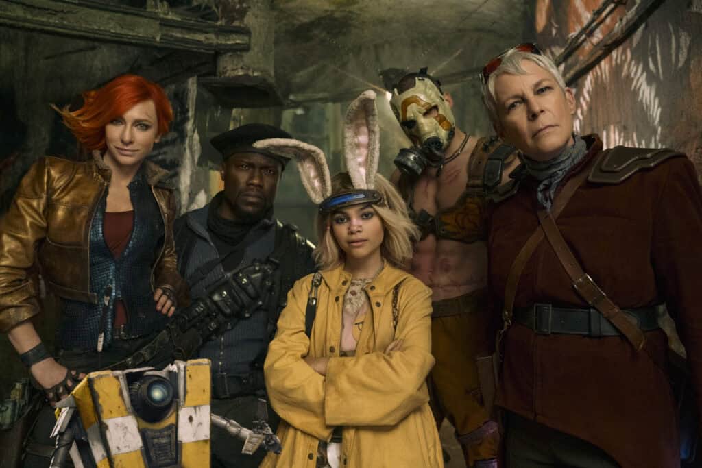 Actors Cate Blanchett, Kevin Hart, Jamie Lee Curtis, Ariana Greenblatt, Florian Munteanu, and Jack Black standing together as their Borderlands characters